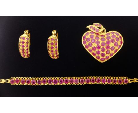 21ct gold ruby heart shaped pendant stamped 90%, matching pair ear-rings and bracelet    Condition Report  with additional ex