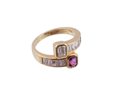  A ruby and diamond crossover ring,   the terminals set with a rectangular shaped ruby and a rectangular shaped diamond in co