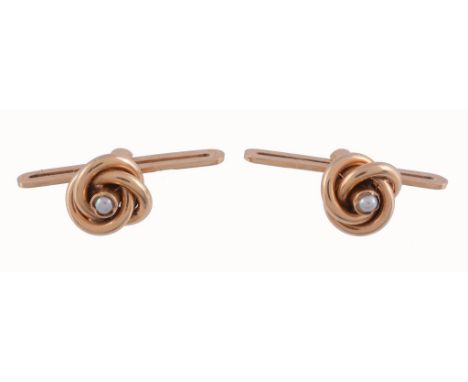  A pair of Swedish 18 carat gold seed pearl cufflinks,   the knot terminals each centred with a half seed pearl, 8mm diameter