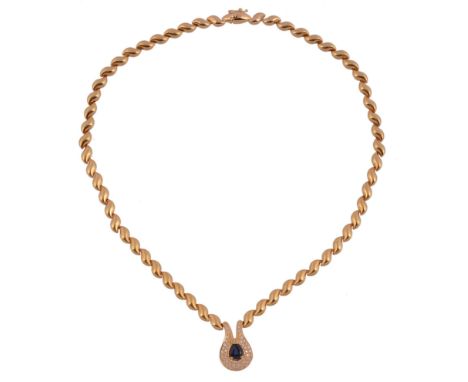 A diamond and sapphire necklace,   the shaped panel with a central pear cut sapphire within a surround of brilliant cut diam