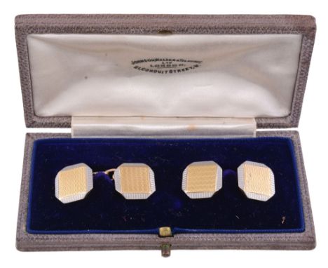  A pair of gold and platinum cufflinks  , circa 1930, the octagonal panels with a central square of textured gold, to platinu