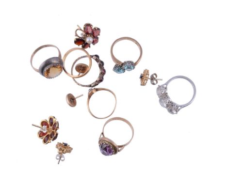  A small collection of jewellery,   to include: a single stone diamond ring; a three stone white zircon ring, the shank stamp