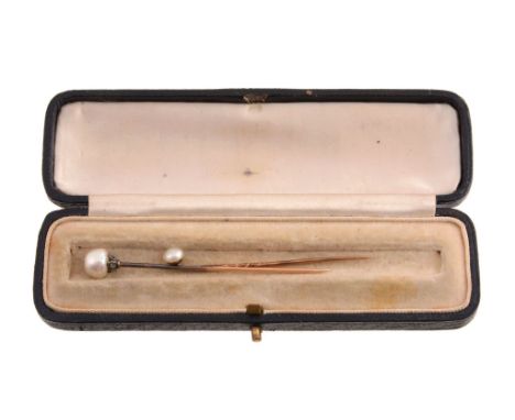  A French pearl stick pin,   circa 1900, the pearl terminal with rose cut diamond base, French poincon to the stick; together