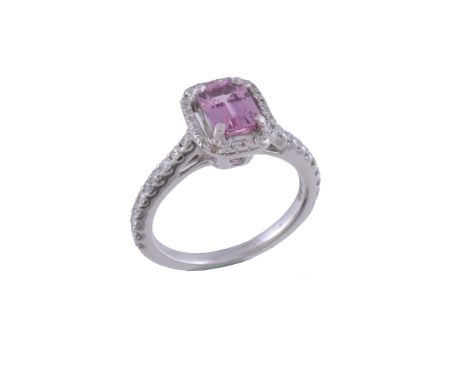  A diamond and pink sapphire cluster ring  , the step cut pink sapphire with canted corners, within a surround of brilliant c