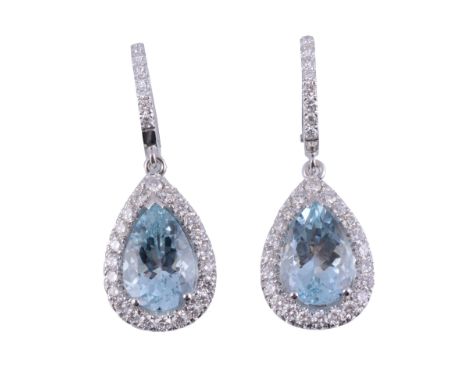  A pair of aquamarine and diamond earrings,   the pear shaped aquamarine claw set within a surround of brilliant cut diamonds