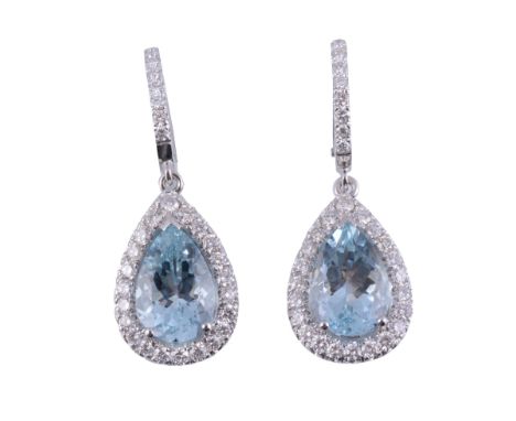  A pair of aquamarine and diamond earrings,   the pear shaped aquamarine claw set within a surround of brilliant cut diamonds