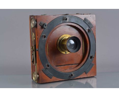 An early 20th Century mahogany and brass Thornton-Pickard Special Ruby Half-Plate Field Camera,  with f/8 brass lens, F, dent