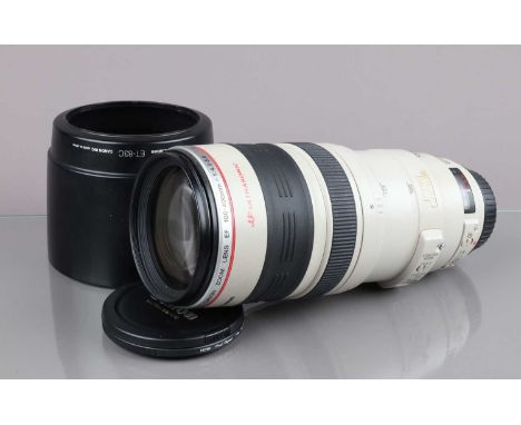 A Canon EF 100-400mm f/4.5-5.6 L IS USM Lens, auto focus functions, barrel G-VG, some fading to grip, elements VG, with front