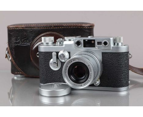 A Leitz Wetzlar Leica IIIg Camera, serial no 890333, 1957, shutter working, rangefinder working, self-timer working, body G, 