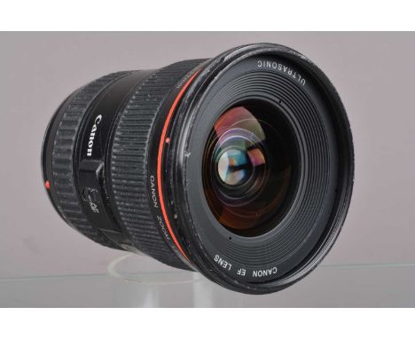 A Canon EF 17-35mm f/2.8 L Ultrasonic Lens, serial no 61055, auto focus working, barrel G, some paint wear to filter ring, li