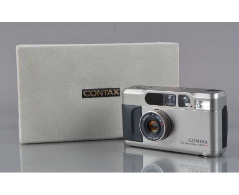 A Contax T2 Titan Silver Compact Camera, serial no 048844, powers up, shutter working, flash working, self-timer working, app