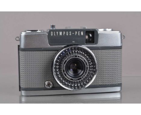 An Olympus Pen EE-2 Half Frame Camera, shutter working, aperture/light cell responsive, body G, elements G, with lens cap