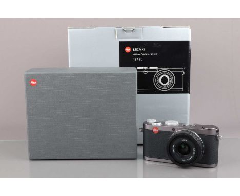 A Leica X1 Digital Camera, powers up, shutter working, flash working, self-timer working, appears to function as should, body