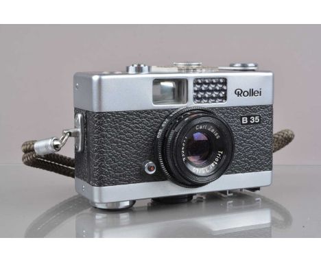 A Rollei B 35 Compact Camera,  made in Singapore,  shutter working, meter responsive,  body G-VG, small scratch to top plate,