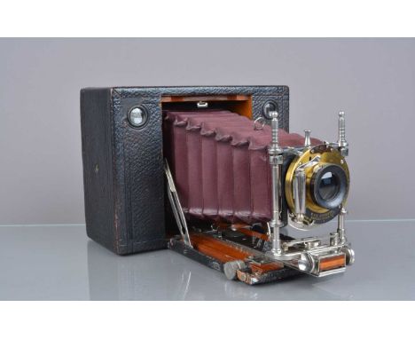 A Kodak No 3 Model E Cartridge Camera, shutter working, body G, folding bed catch worn, some scuffs to leatherette, bellows G