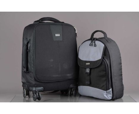 A Think Tank Airport 4 Sight Rolling Camera Case, some light signs of wear, with a Centon backpack and an array of camera rel