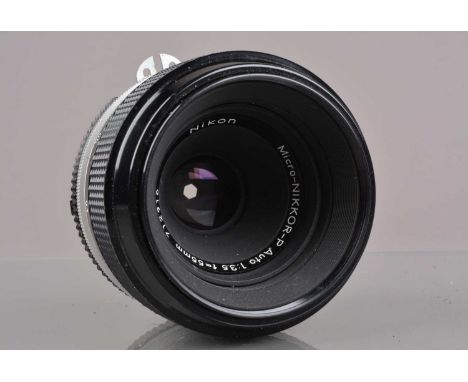 A Nikon Micro-Nikkor-P Auto 55mm f/3.5 AI Lens,  serial no 712916, barrel G, light wear, elements VG, with Nikon front cap an