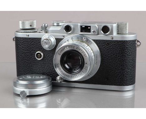 A Leitz Wetzlar Leica IIIa Rangefinder Camera, chrome, serial no 311702, 1939, shutter working, rangefinder functions, body G