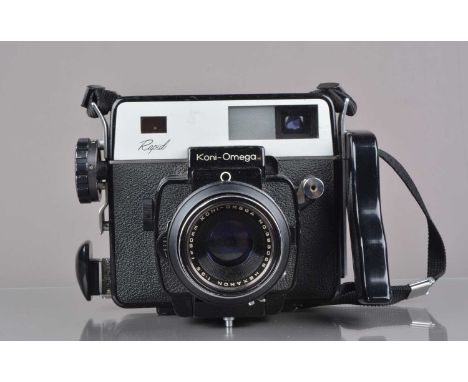 A Koni Omega Rapid Camera, serial no B 11699, shutter working, rangefinder working, body G, some light paint wear, missing ey