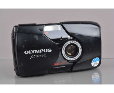 An Olympus mju II Compact Camera, powers up, shutter working, flash working, self-timer working, body F-G, some dull blemish 