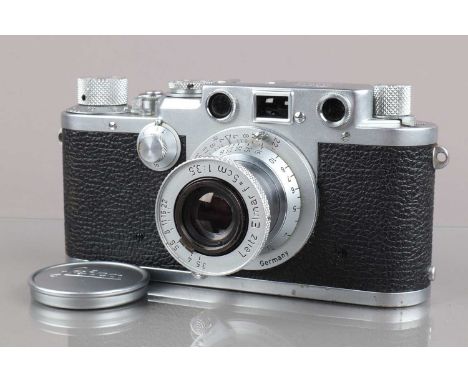 A Leitz Wetzlar Leica IIIf Camera, red dial, serial no 610185, 1956, shutter working, rangefinder working, body G, light wear