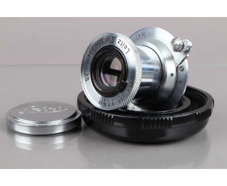 A Leitz 5cm f/3.5 Elmar Lens, serial no 893860, 1951, barrel G, light wear, elements G, some light spotting, with lens cap, i