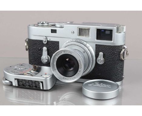 A Leitz Wetzlar Leica M2 Camera, serial no 1012521, 1960, shutter working, some light fogging to viewfinder, rangefinder work