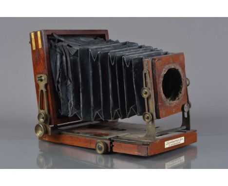 A mahogany and brass Lancaster 'The Special Instantograph Patent' Quarter-Plate Field Camera,  with eight brass-bound corners
