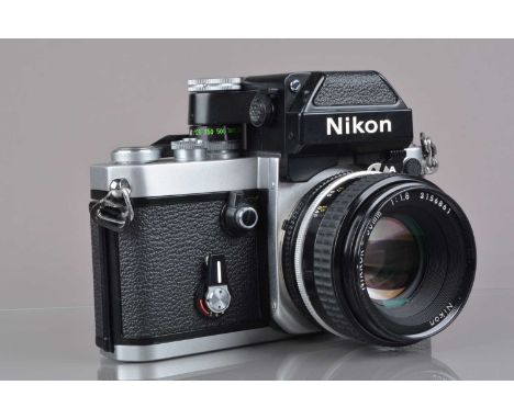 A Nikon F2 Photomic SLR Camera, chrome, serial no 8064222, shutter working, self-timer working, with DP-11 finder, meter resp