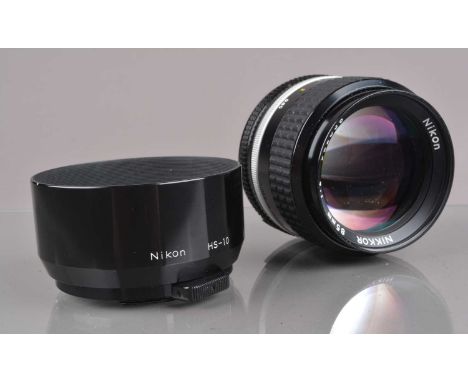 A Nikon Nikkor 85mm f/2 AI-S Lens, barrel G-VG, elements VG, with front/rear caps and HS-10 hood