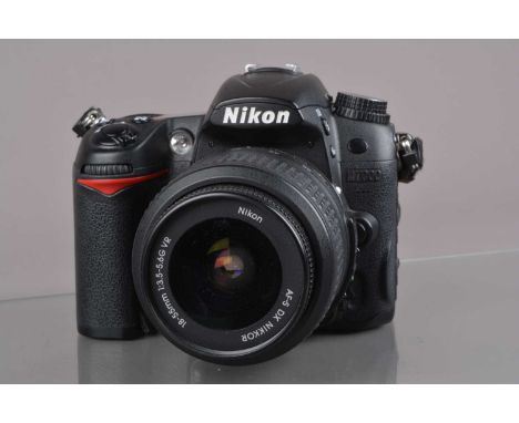 A Nikon D7000 DSLR Camera, serial no 6158784, powers up, shutter working, flash working, appears to function as should, body 