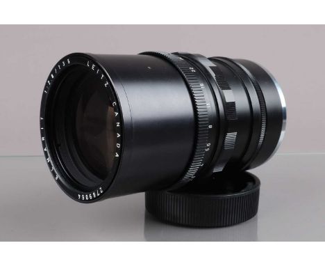 A Leitz Canada Elmarit 135mm f/2.8 Lens, serial no 2789064, 1976, barrel VG, elements G-VG, in 16462 focusing adapter, on Lei