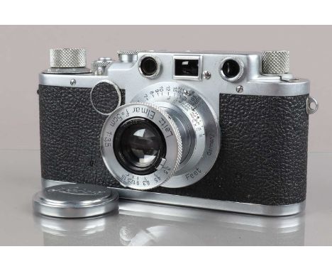 A Leitz Wetzlar Leica IIc Camera,  serial no 447005, 1948-51, shutter working, rangefinder working, body G, light wear, with 