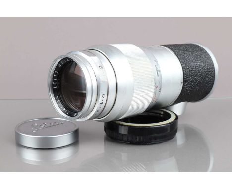 A Leitz Wetzlar 135mm f/4 M Elmar Lens,  serial no 1775781, 1960, barrel G, some scratches to grip, elements G-VG, with Leica