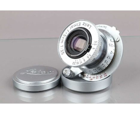 A Leitz 5cm f/3.5 Elmar Lens, red scale Elmar, serial no 1065528, 1953, barrel G, light wear, elements G, light fungus, with 