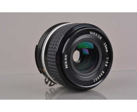 A Nikon Nikkor 35mm f/2.8 AI-S Lens, serial no 536502, barrel G-VG, elements G-VG, with Nikon front cap and unbranded rear ca