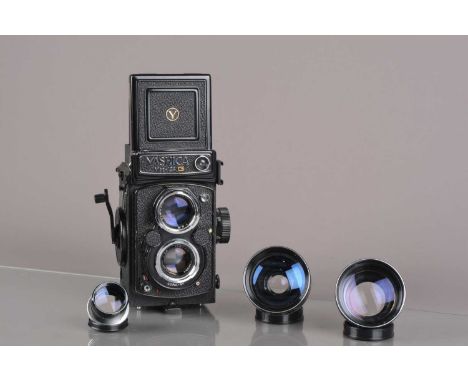 A Yashica Mat 124 G TLR Camera, serial no 1041032, shutter working, meter responsive, self-timer working, body G, some paint 