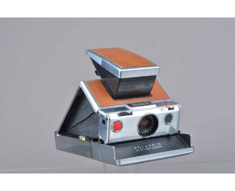 A Polaroid SX-70 Land Camera, tan, untested, body G, some light scuffs to leatherette, bellows G, elements G-VG