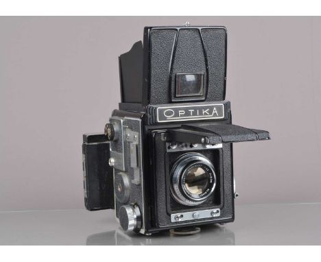 An Optica Model IIA Camera, shutter intermittent, fires on one speed, fires/sticks, shutter curtain G,body G, light wear, bel