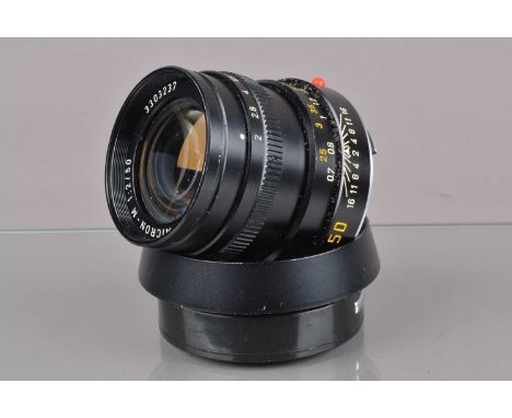 A Leitz Canada 50mm f/2 Summicron-M Lens, serial no 3303237, 1984, barrel G, light paint wear to grip, elements G, some haze/