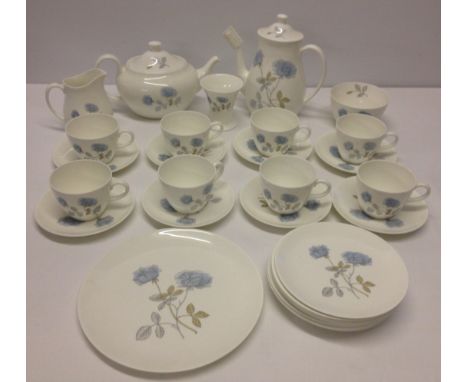 Comprising: tea pot, coffee pot, sandwich plate, 8 cups & saucers and 8 tea plates. 