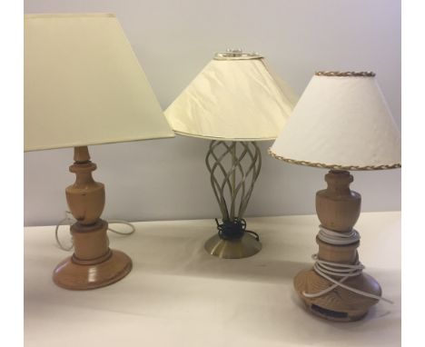  A brass twist design lamp base together with 2 wooden lamp bases. 