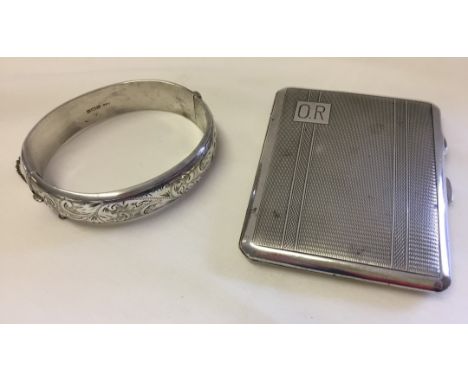Cigarette case has engined turned decoration, HM Birmingham 1938. Safety chain on bangle broken. 
