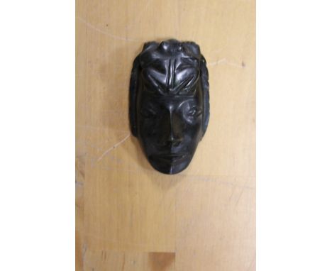 A JADE PENDANT IN THE FORM OF A FACE MASK -  WITH SOME REPAIR