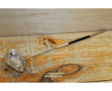 A VINTAGE CONTINENTAL SILVER LADLE WITH EBONISED HANDLE