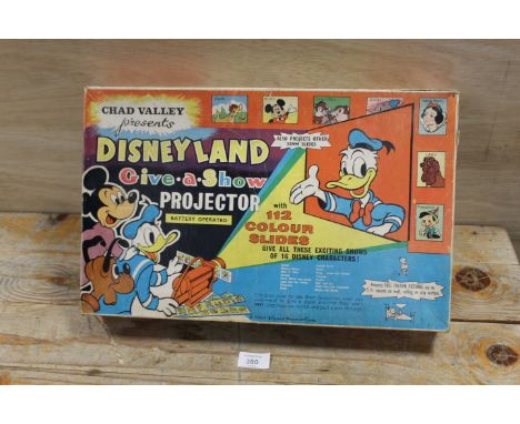 A BOXED CHAD VALLEY DISNEYLAND GIVE A SHOW PROJECTOR WITH SLIDES - NOT TESTED