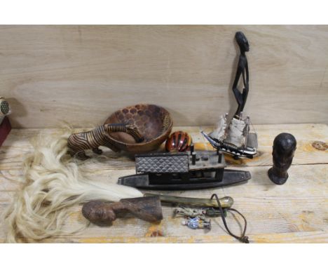 EAST AFRICAN TRIBAL ART CARVED HORN FLY SWISH WITH INLAID WHITE METAL, MODEL WOODEN BOAT, TWO TRIBAL BUSTS, AN EAST AFRICAN C