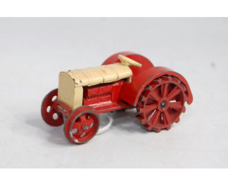 A Dinky Toys pre-war No. 22E farm tractor, comprising red and green body with tow hook (VG for age)