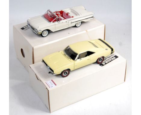 A Danbury Mint 1/24 scale boxed diecast group to include a 1960 Chevrolet Impala, and a 1969 Dodge Charger R/T both in the or