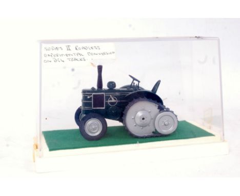 A 1/32 scale white metal and resin model of a Field Marshall Series 2 Roadless Experimental Converted Tractor, finished in da